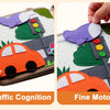 A Montessori giraffe busy board showing traffic cognition and fine motor activities with colorful shapes on a wooden board.
