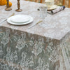 Elegant white lace tablecloth with French retro floral design set for a wedding or party.