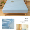 Light blue soft brushed fitted sheet displayed on a bed with natural wood accents.