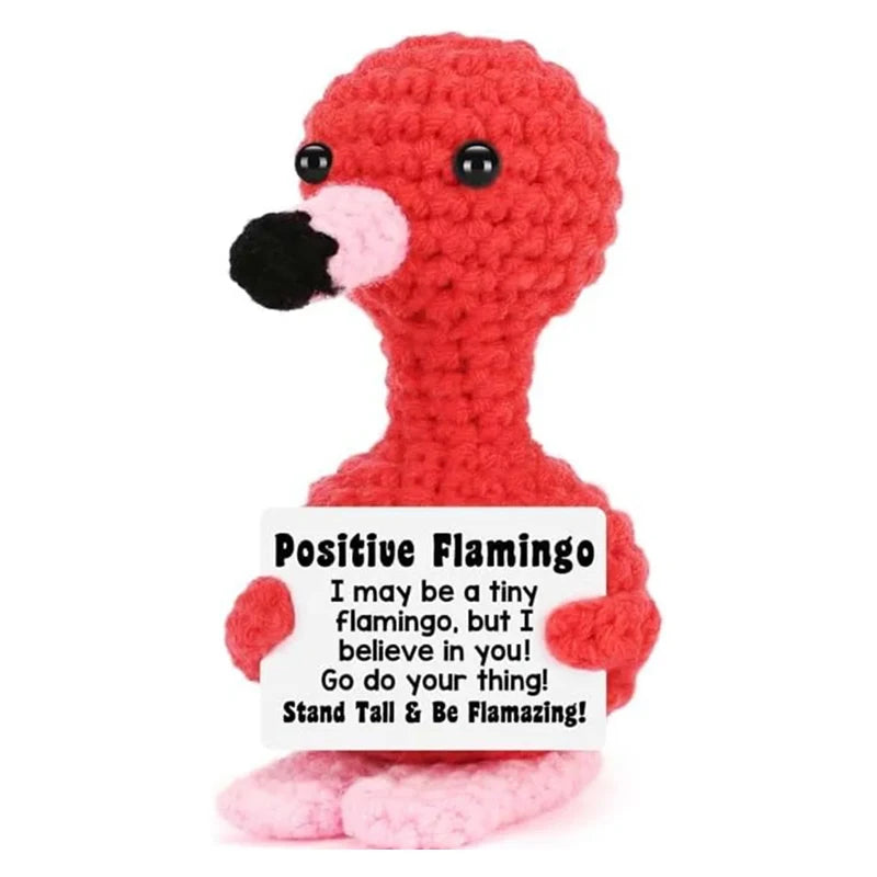 Red crochet flamingo doll with a positive message card that reads I may be a tiny flamingo but I believe in you go do your th