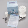 A box and white hand-operated yarn ball winder tool for knitting and crochet is shown on a gray surface.