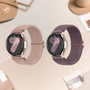 A pair of rose gold Quick-Release braided nylon watch bands with a dark face and rose gold casing.