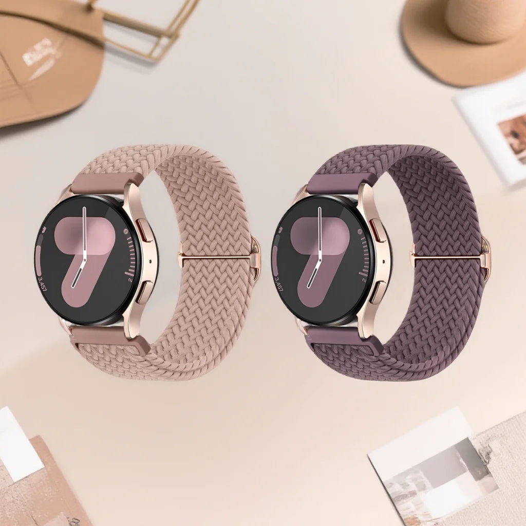 A pair of rose gold Quick-Release braided nylon watch bands with a dark face and rose gold casing.