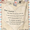 A cream-colored fleece throw blanket with a heart design and text expressing love and pride for a daughter.
