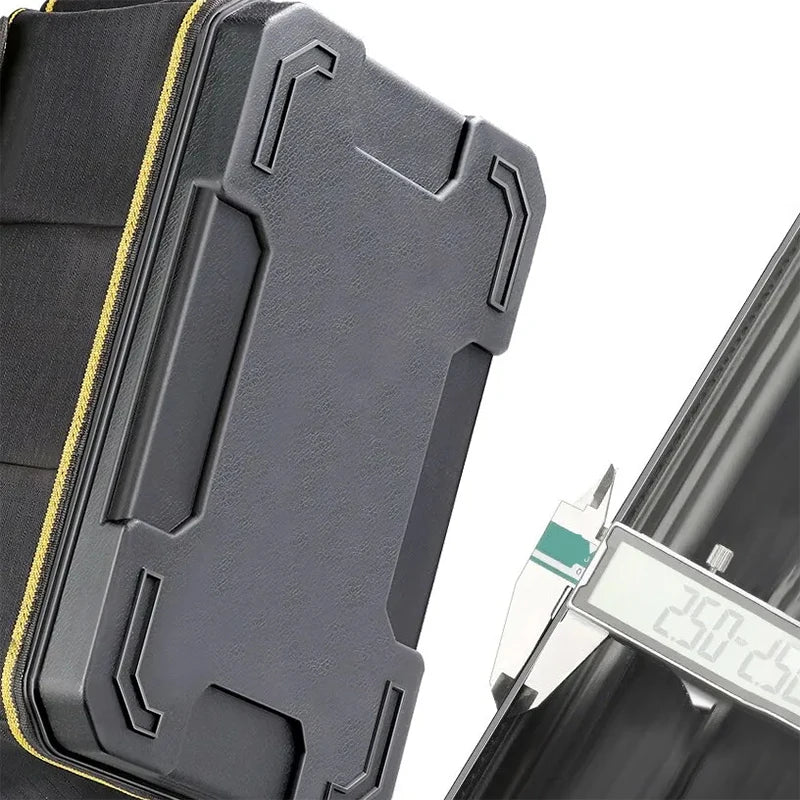 A close-up view of a gray heavy-duty waterproof tool organizer bag with textured panels and yellow stitching.