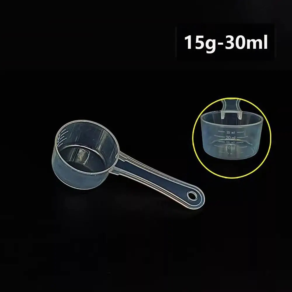 A clear plastic measuring cup with a long spout is shown next to an inset showing volume markings.
