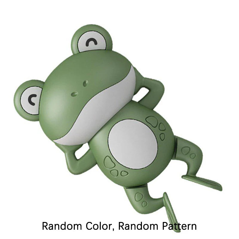 A green wind-up swimming frog bath toy with large eyes and limbs.
