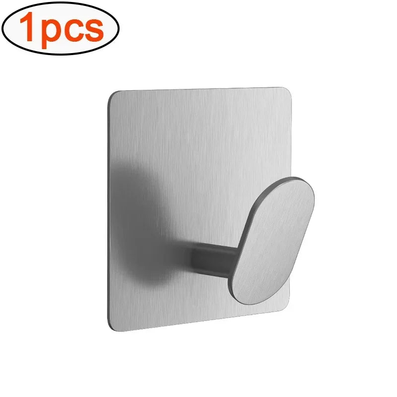 A single silver adhesive stainless steel robe hook for a no-drill wall mount.