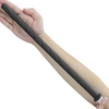 A hand is holding a black silicone handheld bidet sprayer for toilet.