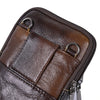 A close-up view of a brown genuine cowhide leather crossbody sling bag with stitched details and metal hardware.