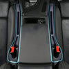 A pair of car seat gap filler organizers with grooves shown in a dark automotive interior.
