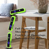 A collection of bright lime green silicone TV remote covers with lanyards displayed on a wooden table.