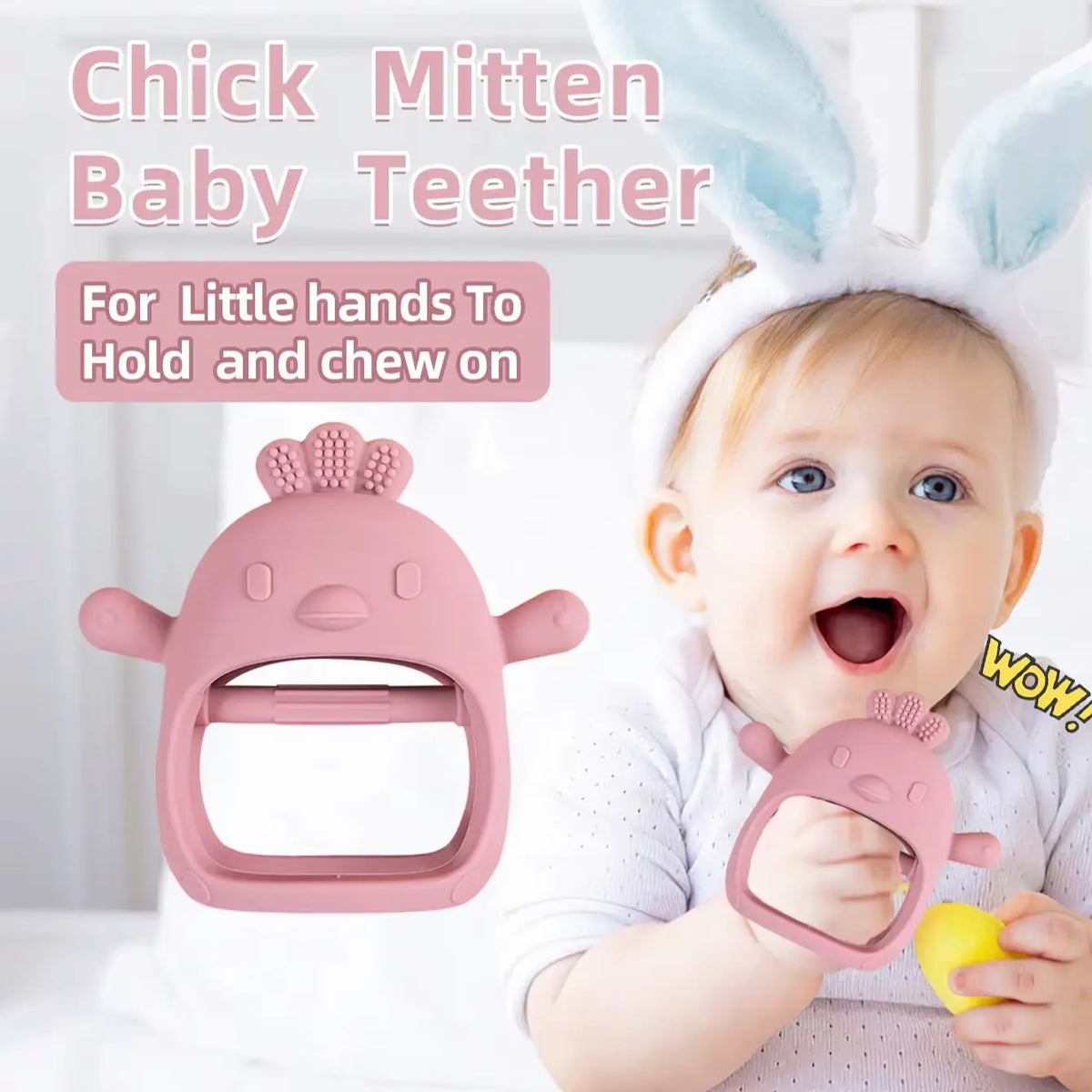 A baby is holding a pink silicone chick mitten teether for gum relief