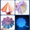 Three views of a pink and purple 3D illusion fidget star toy showing its spiral structure.
