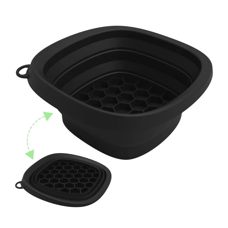 A black foldable silicone ice bath and facial massage bowl shown with the lid removed.