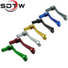 A collection of various colored CNC aluminum folding gear shift levers for motorcycles and dirt bikes.