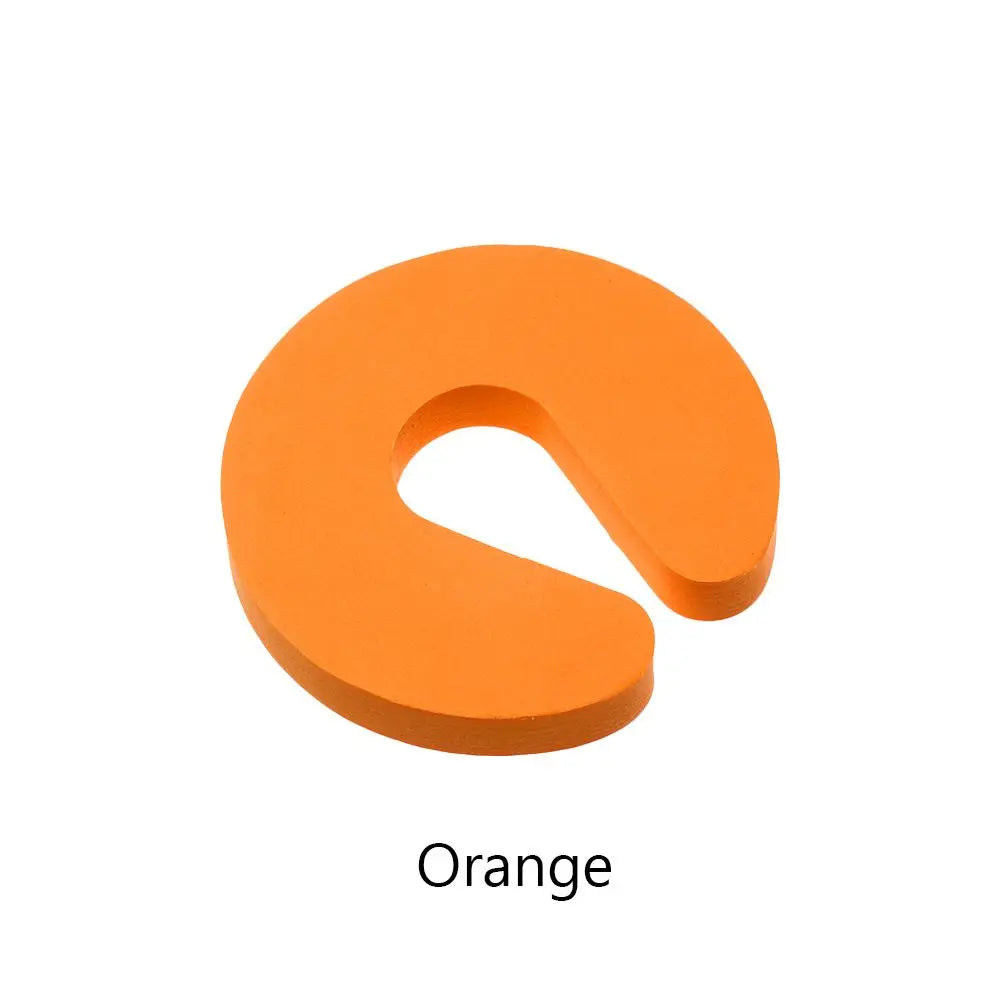 Orange foam door stopper with a finger pinch protection design.