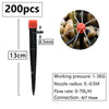A black drip irrigation kit with a 13cm length and a 6.5mm nozzle, featuring an orange component for controlled watering.