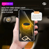 A hand holds a smartphone displaying an orange ambient light source used for car interior or PC lighting.