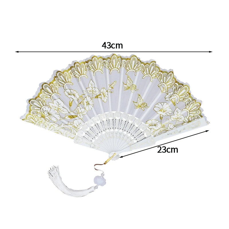 A white folding fan with a lace trim and golden edge, shown flat.
