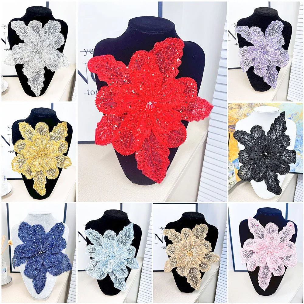 A collection of 12 floral lace applique patches in various colors and textures, including red, purple, black, gold, silver, b