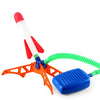 An orange and blue stomp rocket launcher with a white and red foam tip and a green flexible tube.