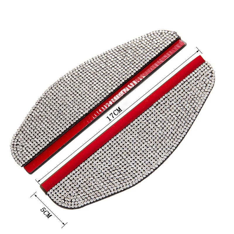 A pair of rhinestone car rearview mirror rain guards with red accents shown diagonally.