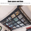 Black mesh car ceiling cargo net used to organize and store light items like tissues and baby quilts in a vehicle.