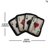 A set of five embroidered playing card patches featuring aces and a skull design with hook and loop backing.