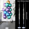 A set of two 19-tube clear plastic balloon column stands for party decor displayed against a white wall.