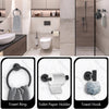 Matte black bathroom hardware set including a towel ring, toilet paper holder, and towel hook