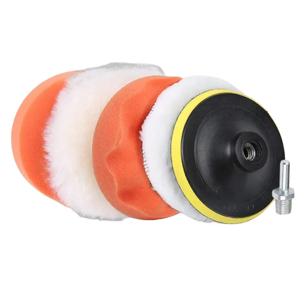 A set of six orange and white polishing pads with a black drill adapter for car detailing.