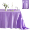A purple satin tablecloth set for dining or events, featuring a square cover and elegant glassware.
