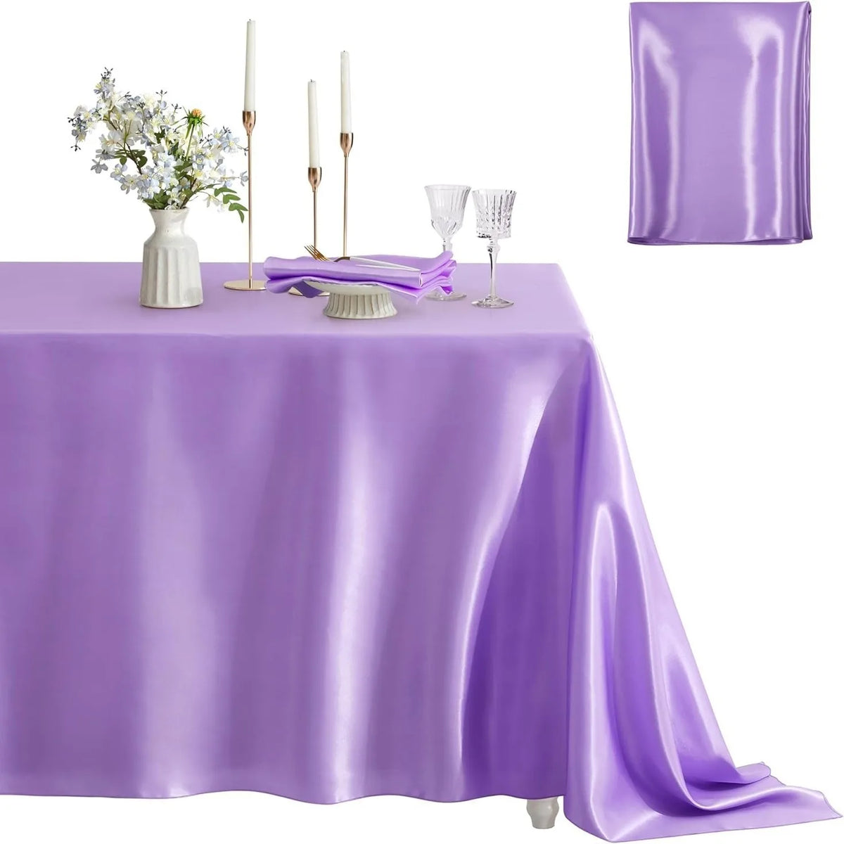 A purple satin tablecloth set for dining or events, featuring a square cover and elegant glassware.