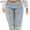 Light blue knitted pants for a fashion doll, shown from the front.