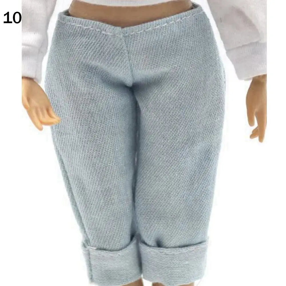 Light blue knitted pants for a fashion doll, shown from the front.