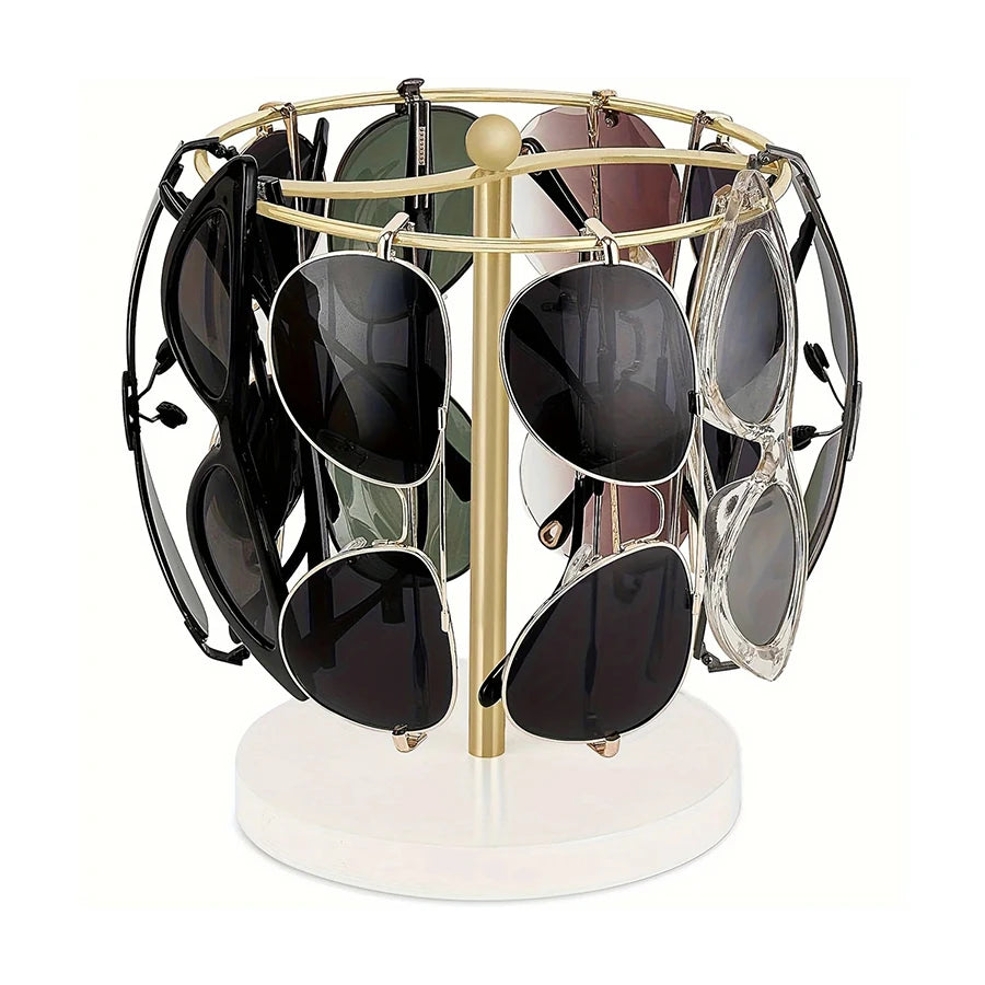 A gold-toned stand holding twelve pairs of sunglasses on a circular wooden base.