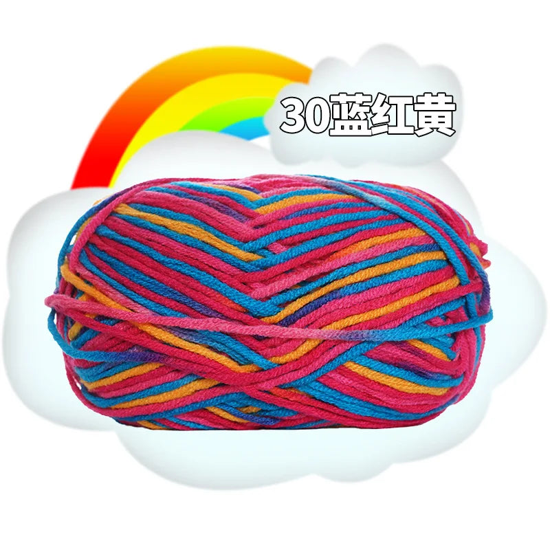 A ball of 30-colored yarn, featuring pink, blue, and orange threads, is shown against a white cloud with a rainbow in the bac