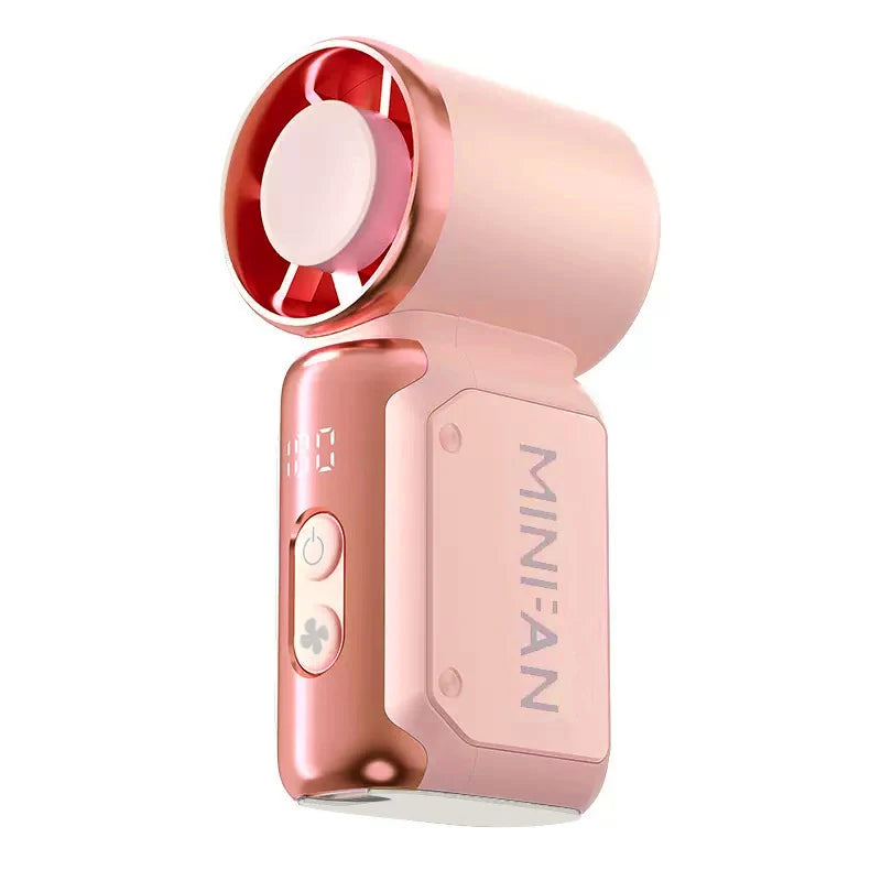 Ventilateur portable rose avec grille rotative et bouton d'alimentation sur fond blanc.
