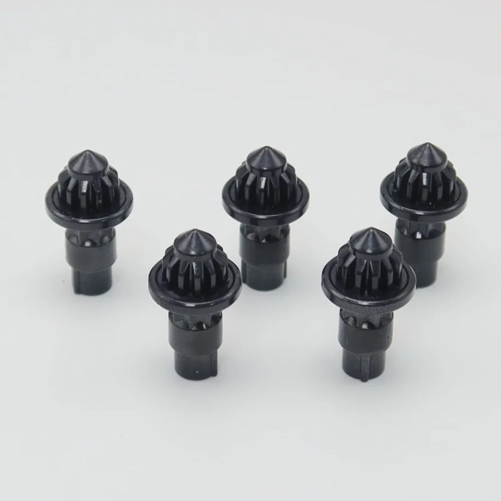 A set of five black replacement drivers for a Battling Top, used to fix or adjust the top.