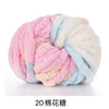 A ball of pink, blue, and white chunky acrylic yarn for knitting and crochet