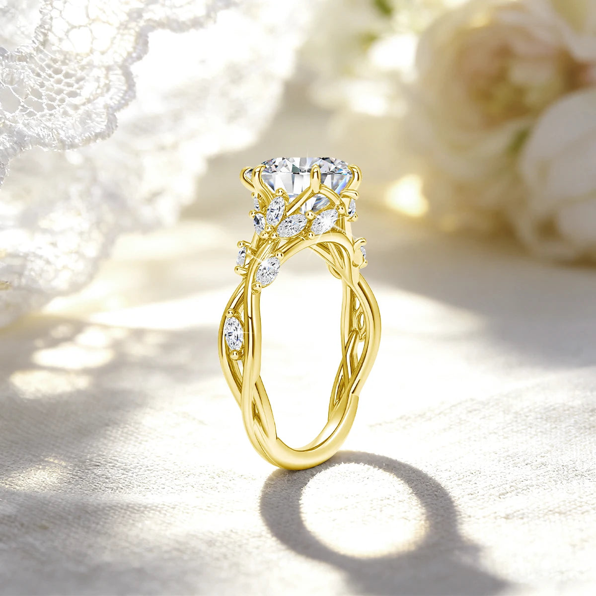 A gold filled moissanite wedding ring featuring a marquise cut diamond and nature-inspired gold setting, resting on a light f