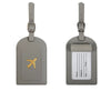 A rectangular gray PU leather luggage tag with a gold airplane emblem and a clear section for name, address, and city.