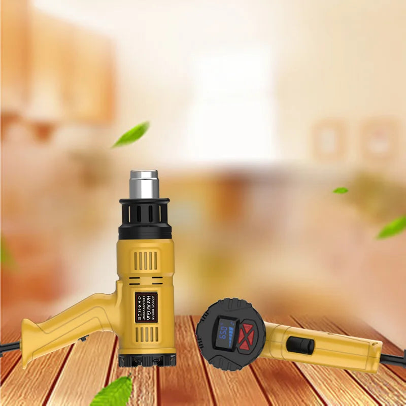 A yellow heat gun with an attached nozzle is shown on a wooden surface.