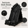 A black gothic arch design phone stand featuring intricate dark details, skulls, and thorn texture.