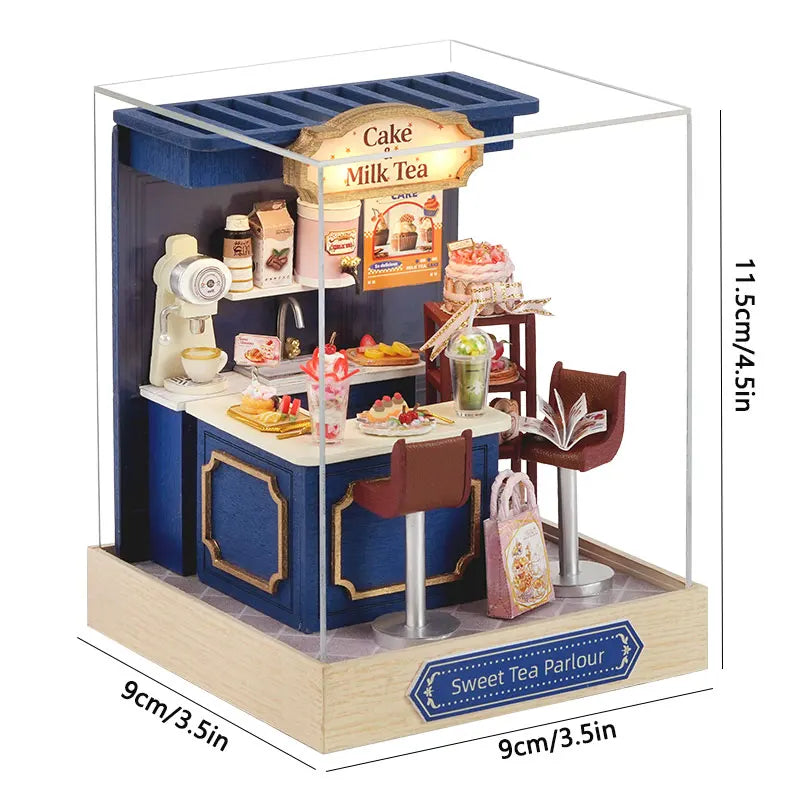 A wooden miniature Japanese sakura tea house display featuring a cake and milk tea setup.