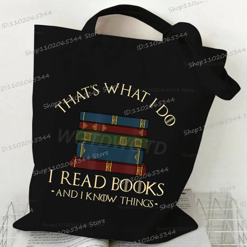 Black canvas tote bag with text that says Thats What I Do I Read Books And I Know Things