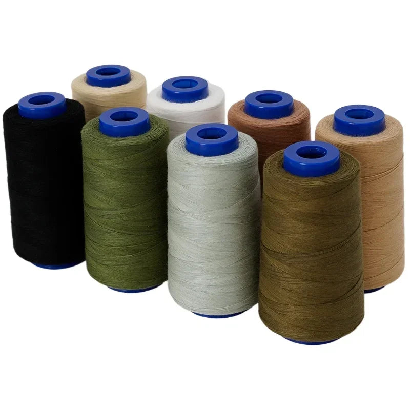 A collection of ten spools of heavy-duty polyester thread in various colors including black, olive green, beige, and light gr