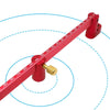 A red aluminum circle drawing ruler and center finder with markings and a brass finder tip.