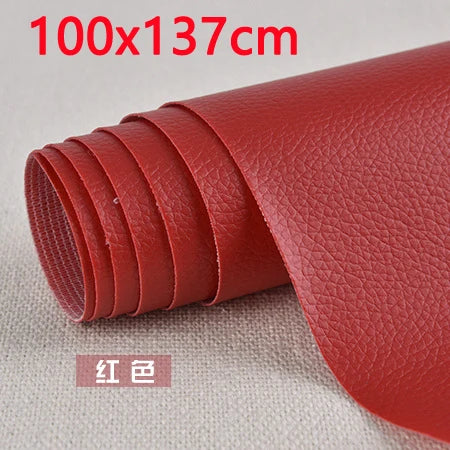 A roll of red PU leather patch measuring 100x137 cm for furniture and craft repairs.